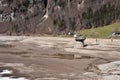 People walking on dry bottom of KlÃÂ¶ntalersee lake in early spring in KlÃÂ¶ntal