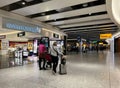 People walking through the duty free shopping area of Heathrow Airport. Royalty Free Stock Photo