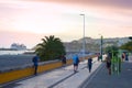 People walking embankment promenade Funchal