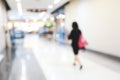 People walking in entrance of gateway terminal, abstract image blur