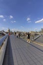 People walking on the Famous Millenium Bridge, London. Royalty Free Stock Photo