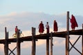 People walking on famous U-Bein teak bridge, Myanmar