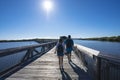 People walking in the Florida park by the lake. Royalty Free Stock Photo