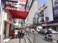 People walking in front of Bata store at Charoen Krung Road