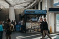 People walking in front of Cafe Nero stall inside King`s Cross s