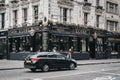 People walking in front of Globe pub, London, UK. Royalty Free Stock Photo