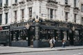 People walking in front of Globe pub, London, UK. Royalty Free Stock Photo