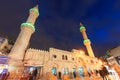 People walking in front of the Grand Husseini Mosque in downtown Amman.