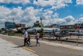 People walking in front of military aircraft on display at seaside park