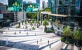 People walking in front of Siam Paragon Department Store at Sukhumvit road Pathumwan Bangkok Thailand