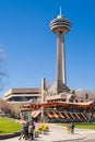 People walking in front of the Skylon Tower, Niagara Falls Royalty Free Stock Photo