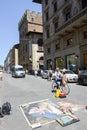 People walking in front of a street artwork at Firenze