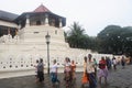 People walking in front of the Temple of the Tooth