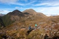 People walking with great backpacks in mountain landscape - trekking hiking mountaneering in mantiqueira range Brazil