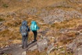 People walking with great backpacks in mountain landscape - trekking hiking mountaneering in mantiqueira range Brazil