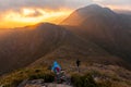 People walking with great backpacks in mountain landscape - trekking hiking mountaneering in mantiqueira range Brazil