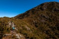 People walking with great backpacks in mountain landscape - trekking hiking mountaneering in mantiqueira range Brazil Royalty Free Stock Photo