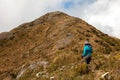 People walking with great backpacks in mountain landscape - trekking hiking mountaneering in mantiqueira range Brazil
