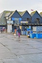 People walking in the cold wet weather .