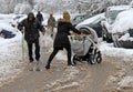 People are walking a snowy icy road after a heavy snowfall in the city of Sofia, Bulgaria on Nov 28,2017, person with cane