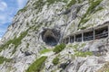 People at hiking trail through Austrian mountains to ice cave Royalty Free Stock Photo