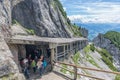 People at hiking trail through Austrian mountains to ice cave Royalty Free Stock Photo