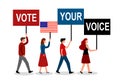 People walking and holding sign of text vote your voice for America president election campaign. Election Day in the country. Voti