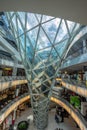 People walking inside Myzeil shopping mall. Frankfurt, Germany