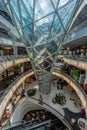 People walking inside Myzeil shopping mall. Futuristic architecture Myzeil shoping center. Frankfurt