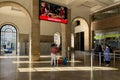 People walking inside Santa Apolonia railway station in Lisbon