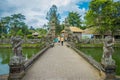 People walking inside of the temple of Mengwi Empire located in Mengwi, Badung regency that is famous places of interest