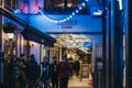 People walking in Kingly Court, a courtyard in the heart of London, UK