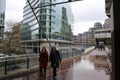 People walking at London Wall, England, urban street scene with modern architecture