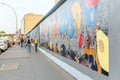 People walking and looking at Art gallery of Graffiti on Berlin Wall at East side