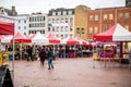 people walking and looking at tents that are on display in an outdoor market Royalty Free Stock Photo