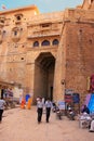 People walking through the main entrance of Jaisalmer fort, India