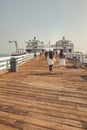 People walking on the Malibu Pier in Southern California Royalty Free Stock Photo