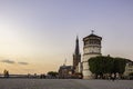 People walking by the Maritime Museum tower along a cobbled path in Dusseldorf, Germany.