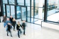 People Walking in Modern Office Building, Motion Blur Royalty Free Stock Photo