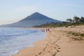 People walking on moledo beach with mount trega on background