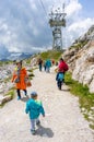 People walking on a mountain footpath