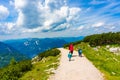 People walking on a mountain footpath