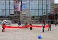 People are walking by Narinkka Square in Helsinki, Finland