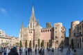 People walking near The Cathedral of the Holy Cross and Saint Eulalia, also known as Barcelona Cathedral in the Gothic quarter of