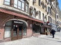 Moscow, Russia, May, 18, 2022. People walking near Khinkalnaya in house 28 on Krasnaya Presnya Street. Russia, the city of Moscow