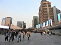 People walking near Ping Finance Building in front of Oriental Pearl Tower, Lujiazui, Pudong, Shanghai, China