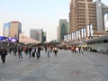 People walking near Ping Finance Building in front of Oriental Pearl Tower, Lujiazui, Pudong, Shanghai, China