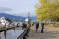 People walking near the Waterfront in downtown Vancouver, British Columbia, Canada Royalty Free Stock Photo