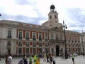 People walking next to the Real Casa de Correos in Puerta del Sol square. Madrid