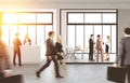 People walking in office with reception Royalty Free Stock Photo